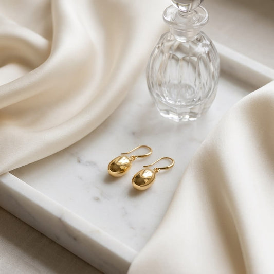 14K Yellow Gold Polished Drop Earrings, on marble vanity tray with silk