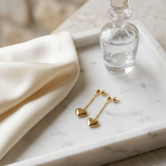 14K Yellow Gold Heart Dangle Stud Earrings, on marble vanity tray with silk