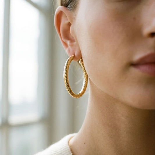 14K Yellow Gold Textured Hoop Earrings, worn close-up portrait