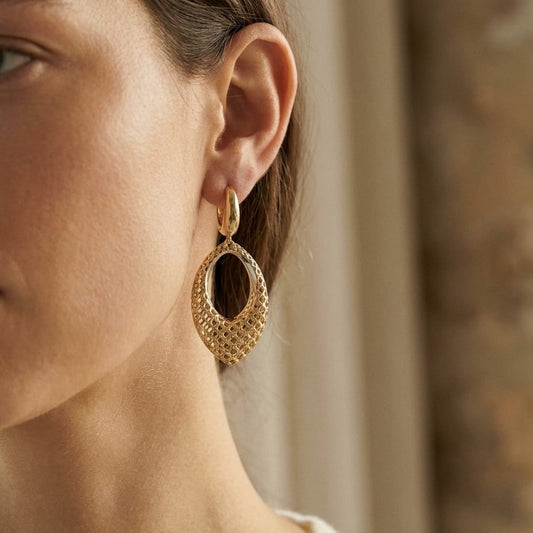 14K Two-Tone Gold Twisted Oval Drop Earrings, worn close-up portrait