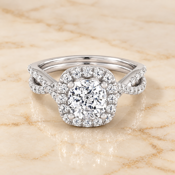 The Audra Twisted Scalloped Pavé Halo Cushion Cut Engagement Ring Setting in 18K White Gold