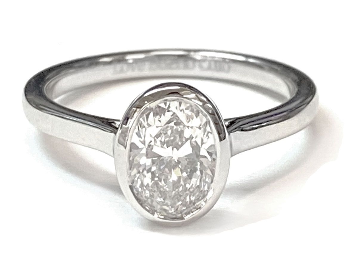 Platinum Oval Simple Bezel Solitaire Engagement Ring
