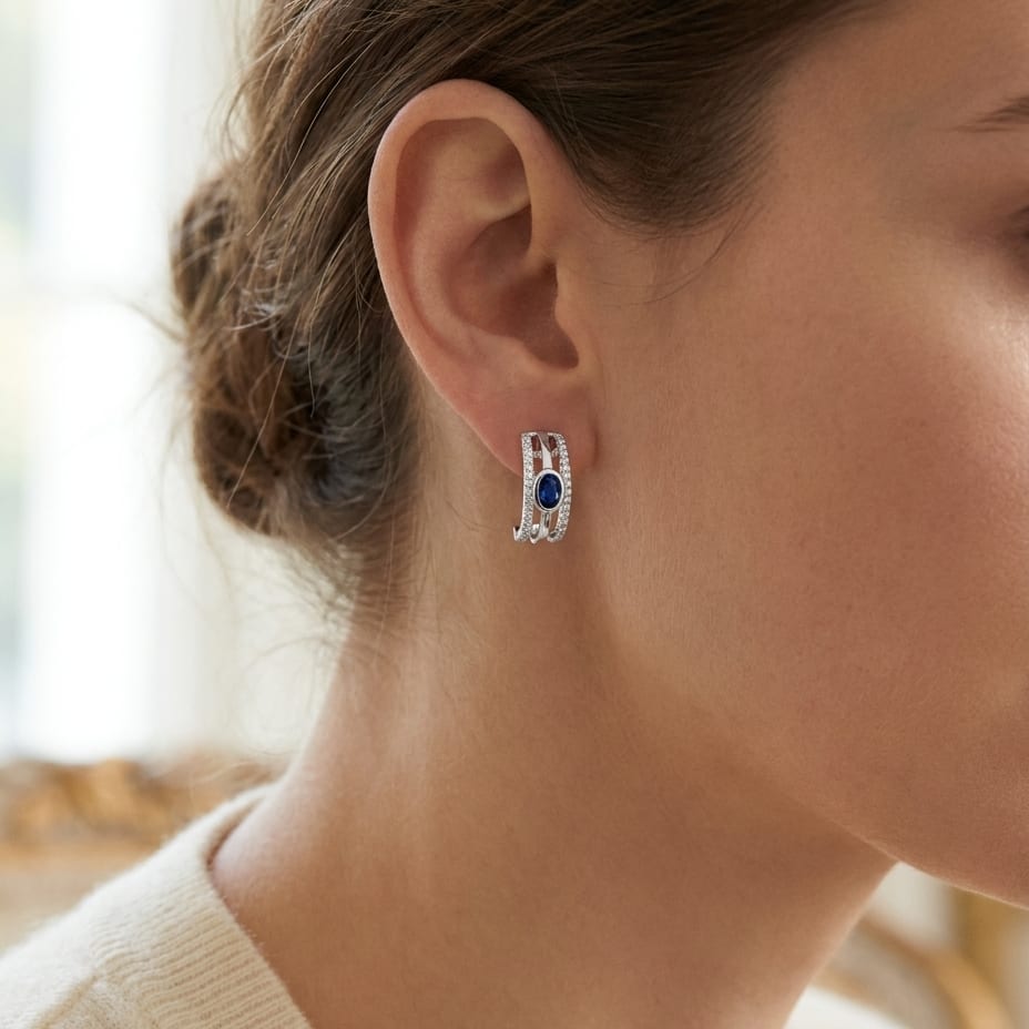 Sapphire Round Brilliant Stud Earrings in 14K White Gold, worn close-up portrait