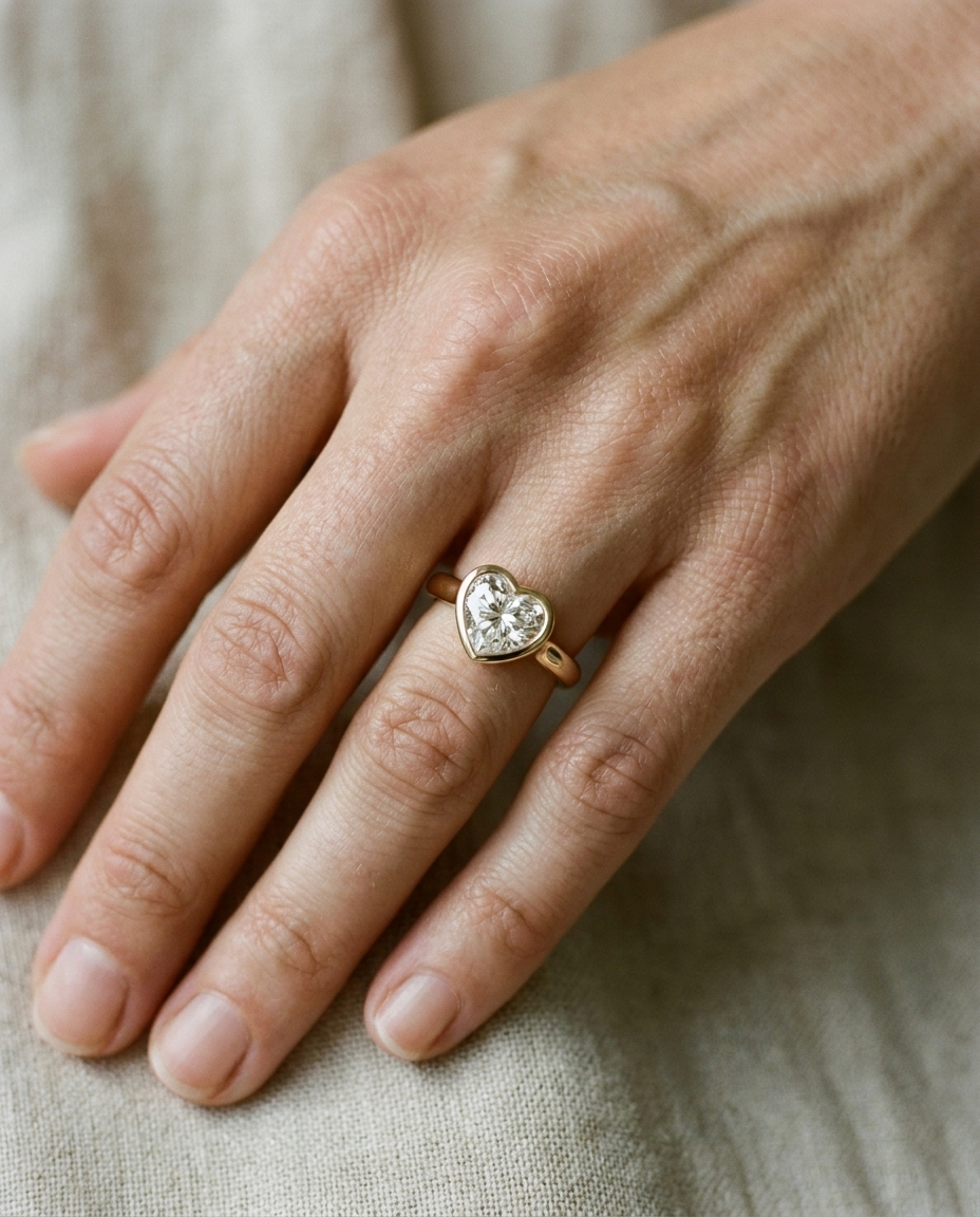 The Agnes Select bezel solitaire heart engagement ring in platinum — on hand — RockHer
