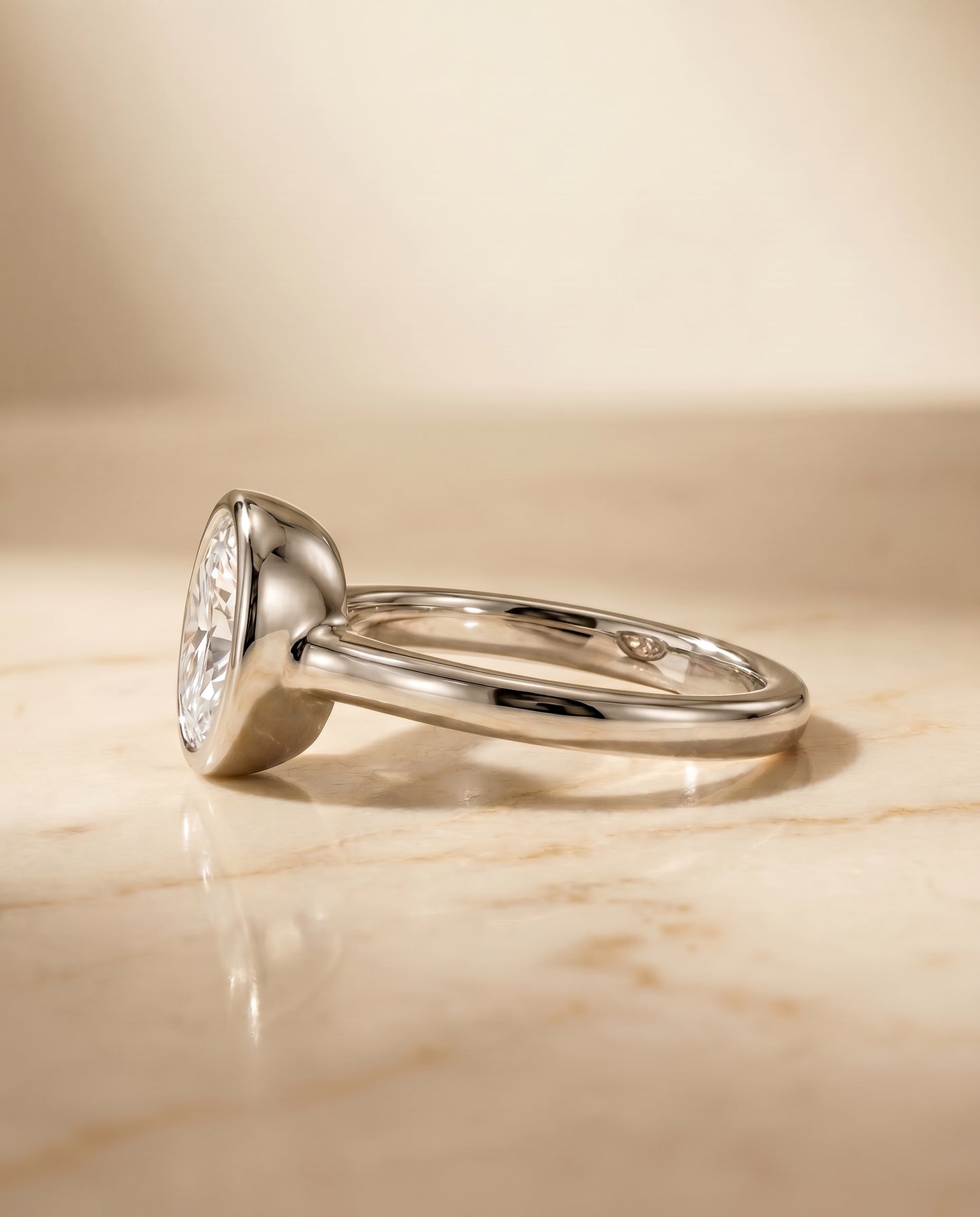 The Agnes Bezel Solitaire Engagement Ring Setting for Oval Diamonds in Platinum