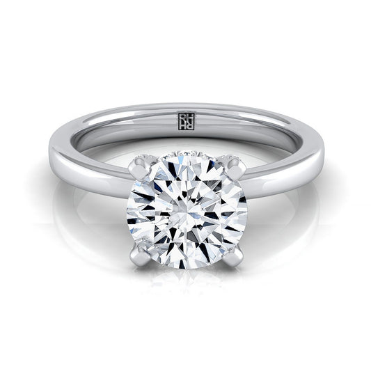 Platinum Round Brilliant Diamond Adorned Claws and Secret Halo Solitaire Engagement Ring -1/10ctw