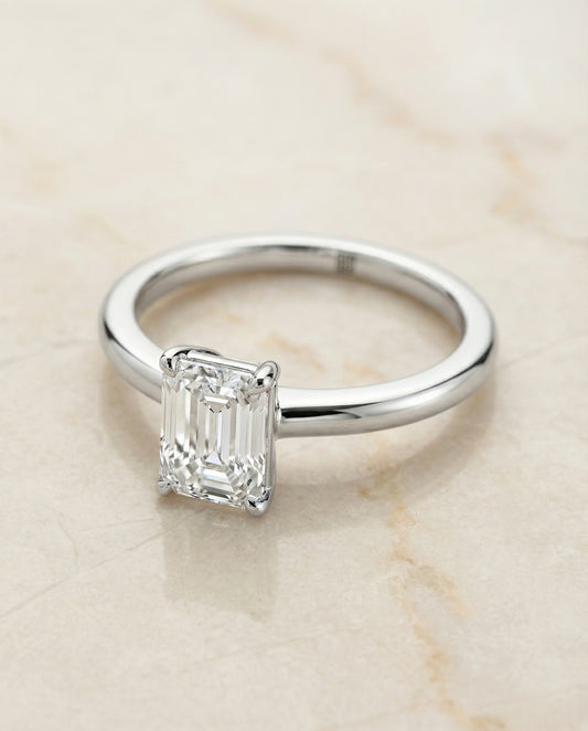 European Cut, Round Comfort Fit Claw Prong Solitaire Emerald, in Platinum – angled view | RockHer