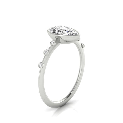 18kw Bezel Set Pear Engagement Ring With 6 Bezel Set Round Diamonds On Shank
