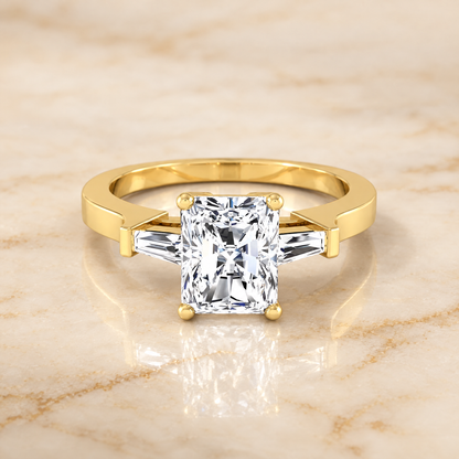The June Three Stone Radiant Cut Engagement Ring Setting in 18K Yellow Gold