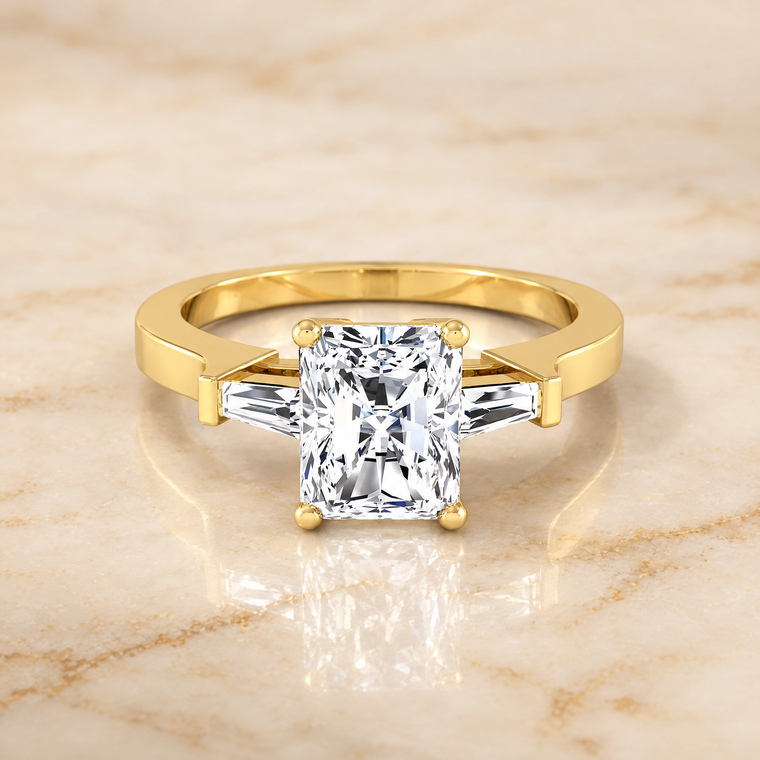 The June Three Stone Radiant Cut Engagement Ring Setting in 18K Yellow Gold