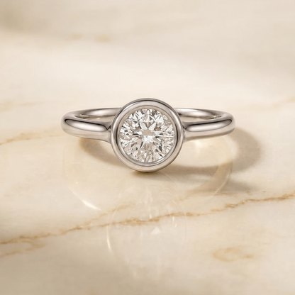 The Agnes Bezel Solitaire In Round Engagement Ring Setting in Platinum