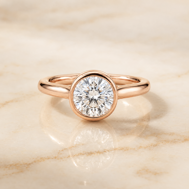 The Duran Simple Bezel Solitaire Round Engagement Ring Setting in 14K Rose Gold