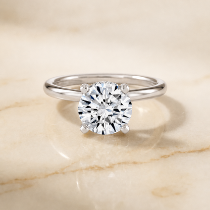 The Lana Secret Halo Adorned Prong Solitaire Round Engagement Ring Setting in Platinum