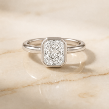 The Agnes Bezel Solitaire In Radiant Cut Engagement Ring Setting in Platinum
