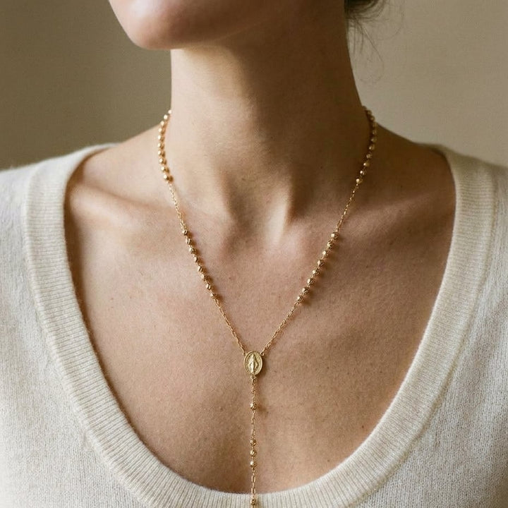 14K Yellow Gold Beaded Station Chain with Cross, 26 Inch, worn close-up portrait