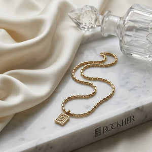 14K Two-Tone Gold Elongated Bar Link Necklace, 20 Inch, on marble vanity tray with silk