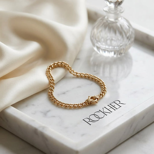 14K Yellow Gold Spiga Chain Bracelet, 7.5 Inch, on marble vanity tray with silk