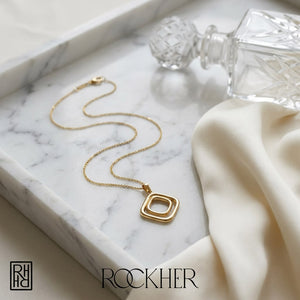 14K Yellow Gold Cable Chain with Pendant, 18 Inch, on marble vanity tray with silk