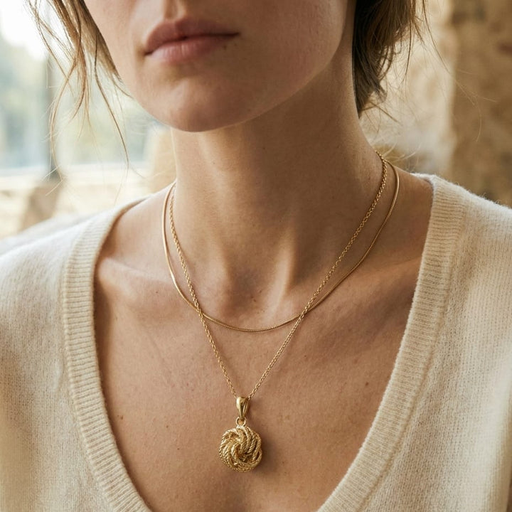 14K Yellow Gold Cable Chain with Love Knot Pendant, 18 Inch, worn close-up portrait