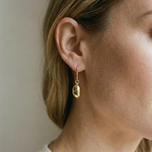 14K Yellow Gold Polished Drop Earrings, worn close-up portrait