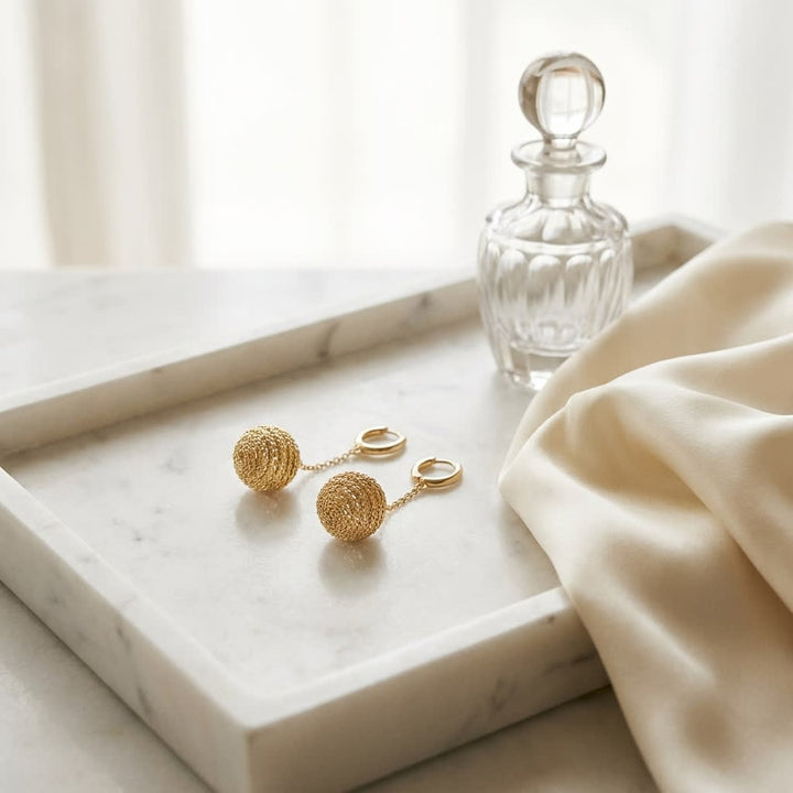 14K Two-Tone Gold Modern Drop Earrings, on marble vanity tray with silk