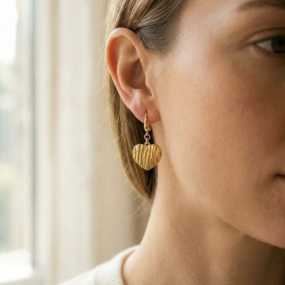 14K Yellow Gold Textured Heart Drop Earrings, worn close-up portrait