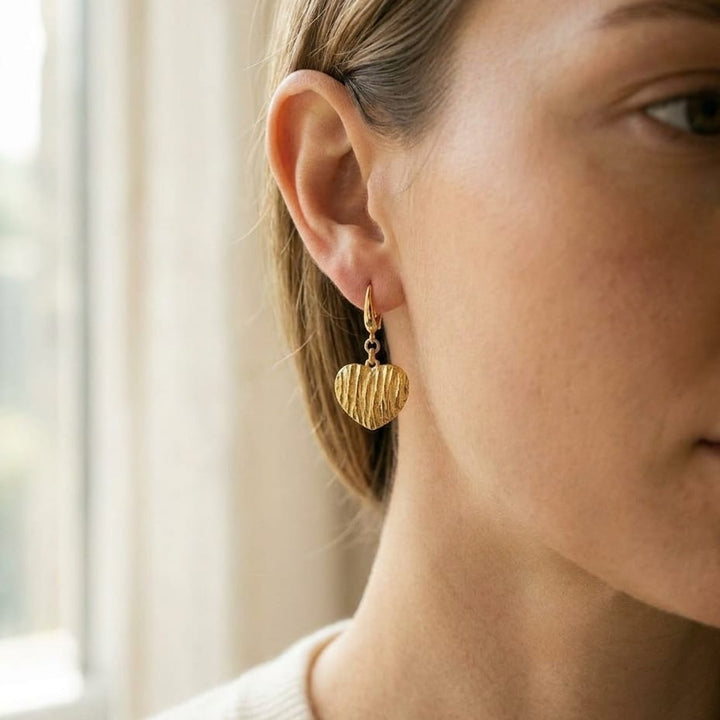 14K Yellow Gold Textured Heart Drop Earrings, worn close-up portrait