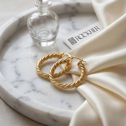 14K Yellow Gold Twisted Rope Hoop Earrings, on marble vanity tray with silk