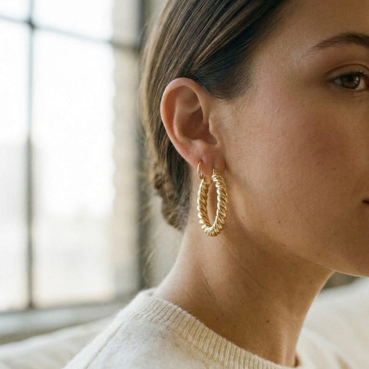 14K Yellow Gold Twisted Rope Hoop Earrings, worn close-up portrait