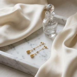 14K Tri-Color Gold Drop Earrings, on marble vanity tray with silk