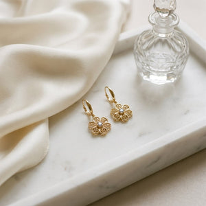 14K Yellow Gold Floral Drop Earrings, on marble vanity tray with silk