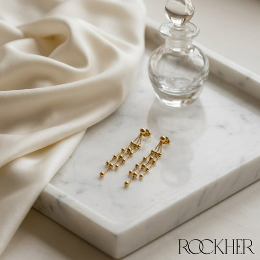 14K Yellow Gold Multi-Strand Beaded Drop Earrings, on marble vanity tray with silk
