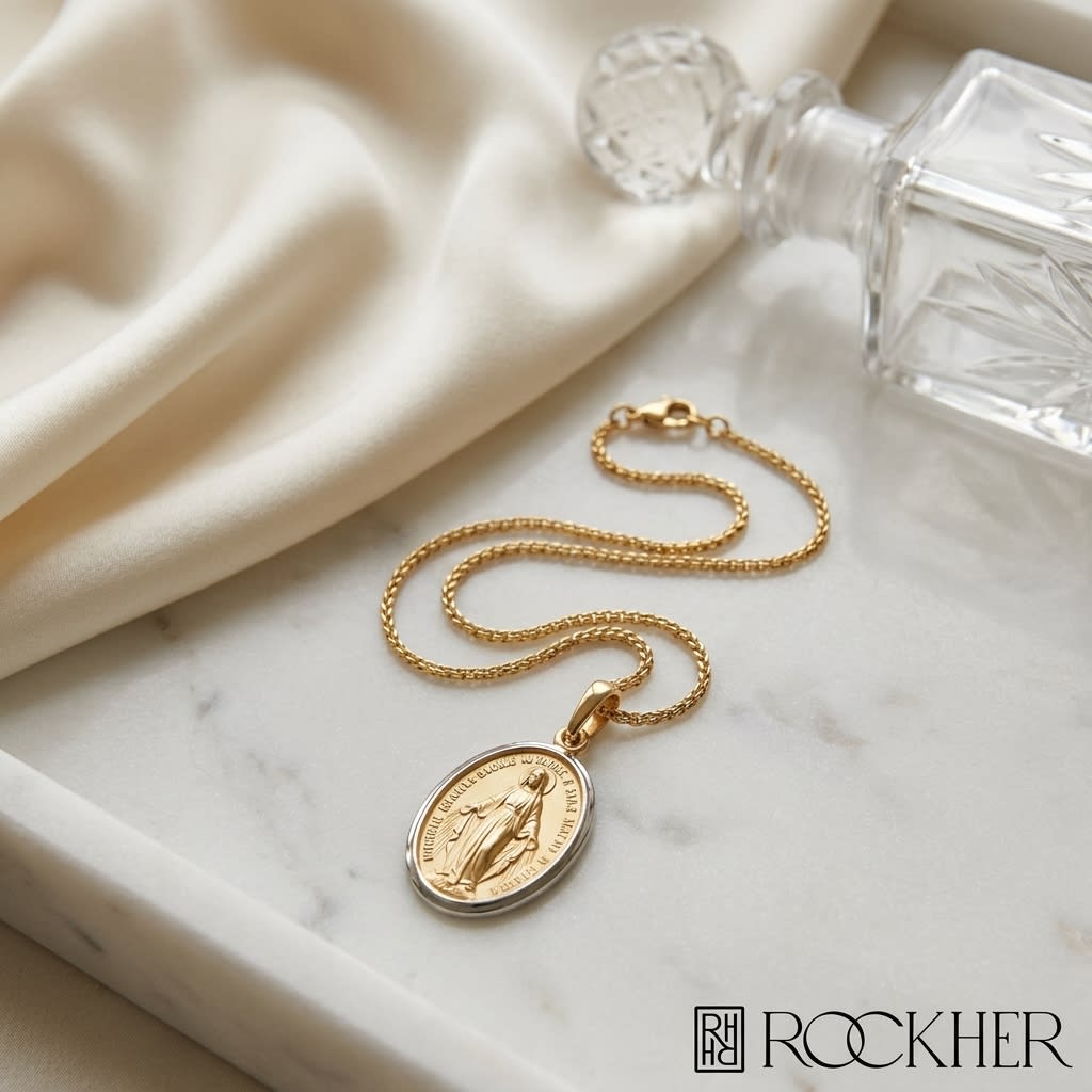 14K Yellow Gold Oval Virgin Mary Medal Necklace, 17 Inch, on marble vanity tray with silk