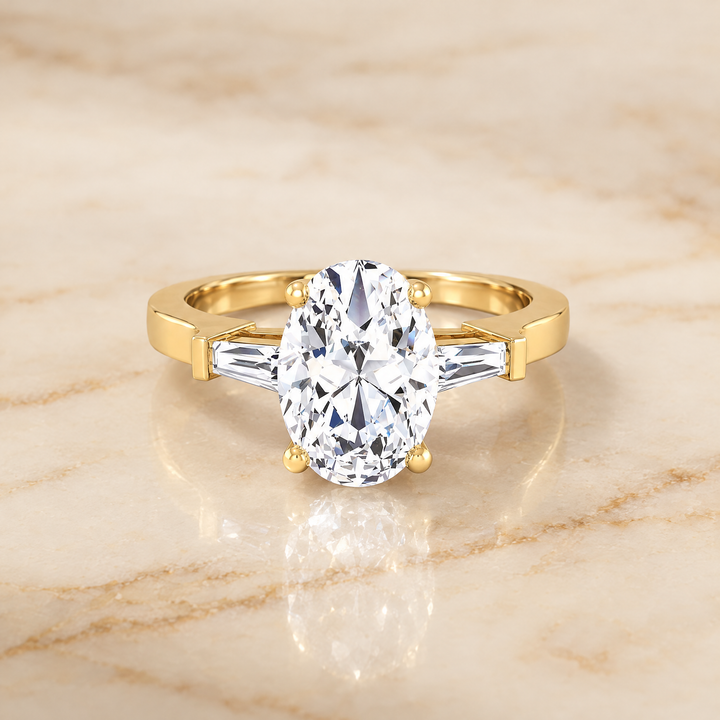 The June Three Stone Oval Engagement Ring Setting in 18K Yellow Gold