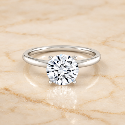 The Joni Hidden Halo Solitaire Round Engagement Ring Setting in Platinum