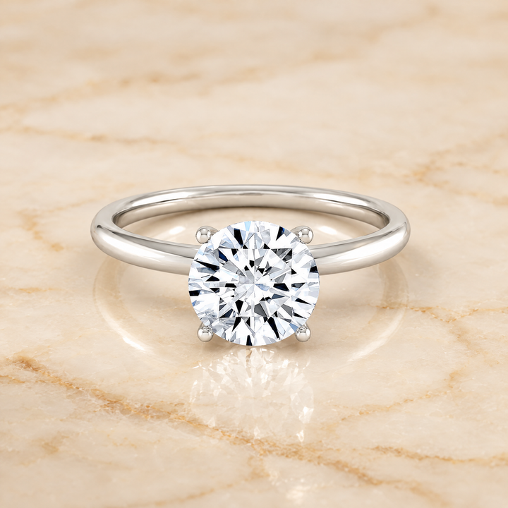 The Joni Hidden Halo Solitaire Round Engagement Ring Setting in Platinum