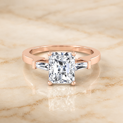 The June Three Stone Radiant Cut Engagement Ring Setting in 14K Rose Gold