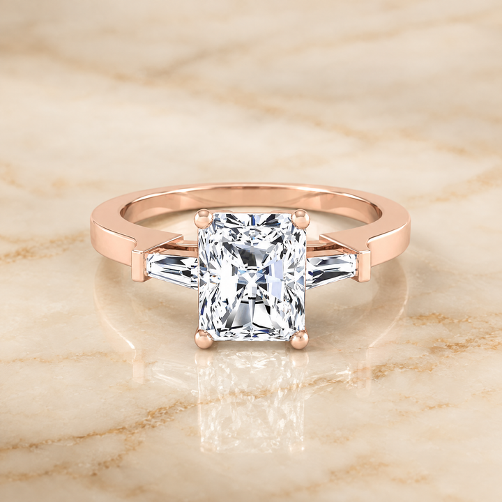 The June Three Stone Radiant Cut Engagement Ring Setting in 14K Rose Gold