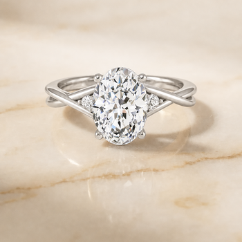 The Dusty Hidden Halo Solitaire Oval Engagement Ring Setting in 18K White Gold