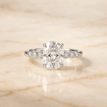 The Peggy Bezel Accent Solitaire Oval Engagement Ring Setting in Platinum