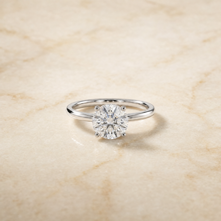 The Joni Hidden Halo Solitaire Round Engagement Ring Setting in Platinum