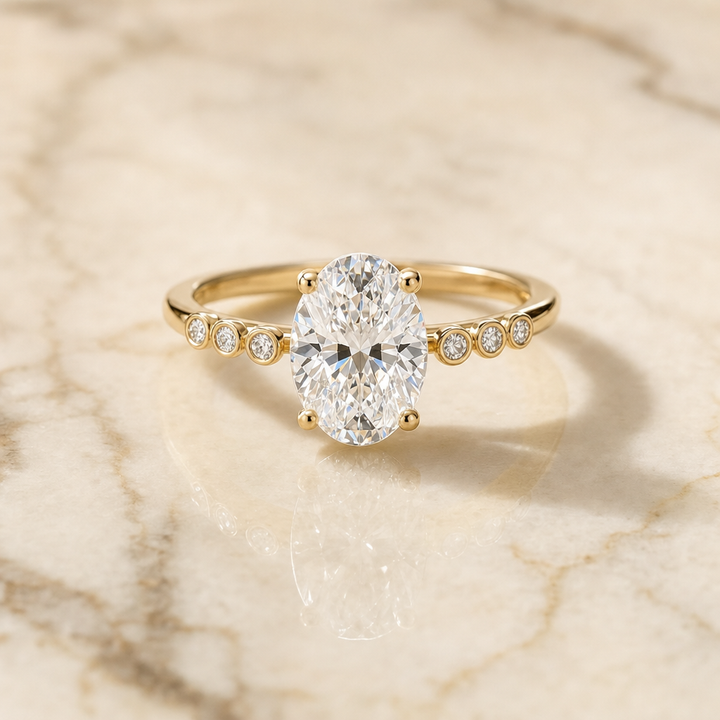 The Peggy Bezel Accent Solitaire Oval Engagement Ring Setting in 18K Yellow Gold