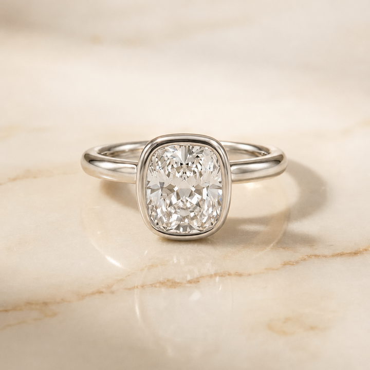 The Agnes Bezel Solitaire In Cushion Cut Engagement Ring Setting in Platinum
