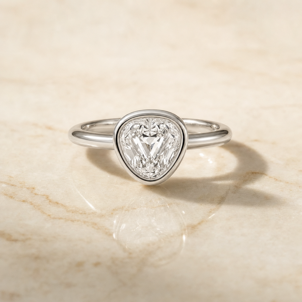 The Agnes Bezel Solitaire In Shield Engagement Ring Setting in Platinum