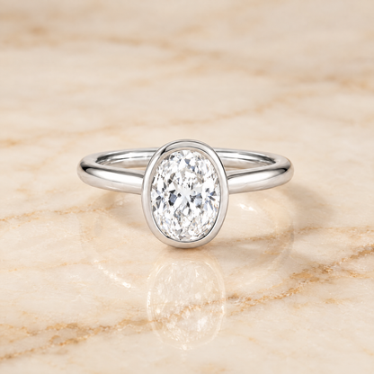 The Duran Simple Bezel Solitaire Oval Engagement Ring Setting in Platinum
