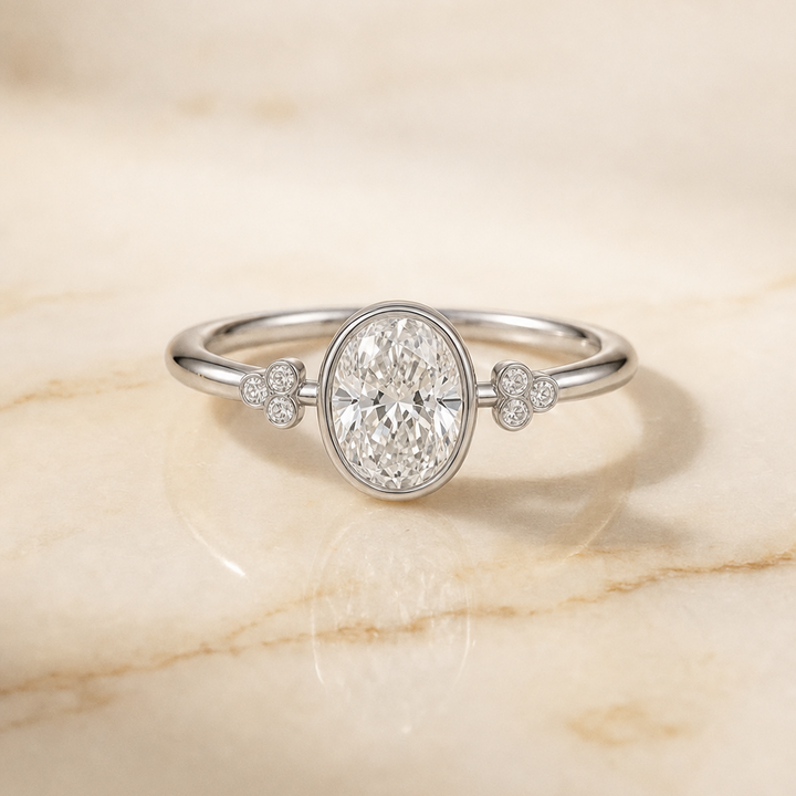 The Selena Clover Bezel Accent Solitaire Oval Engagement Ring Setting in Platinum