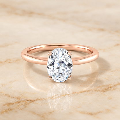 The Floria Comfort Fit Claw Prong Solitaire Oval Engagement Ring Setting in 14K Rose Gold