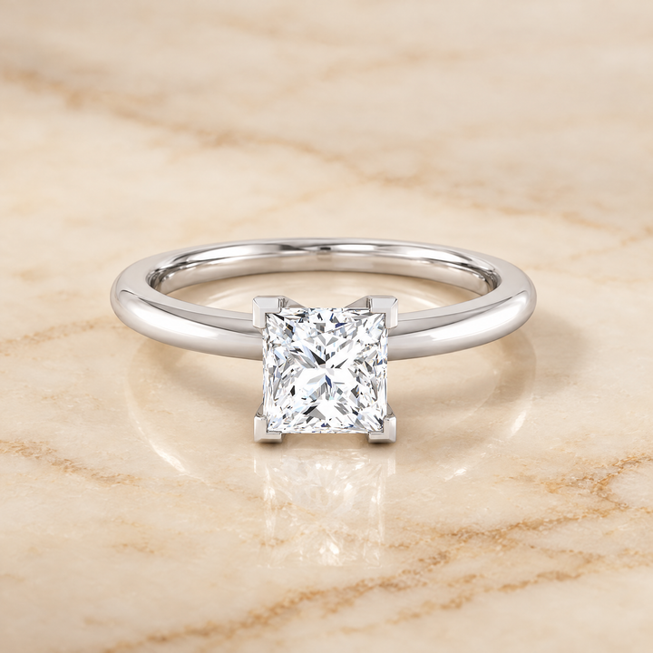 The Floria Comfort Fit Claw Prong Solitaire Round Engagement Ring Setting in 18K White Gold