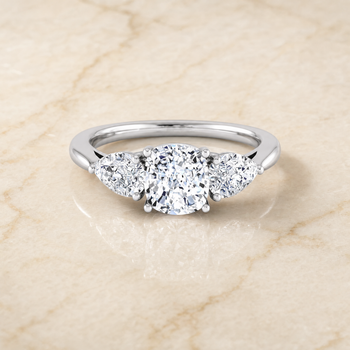 The Angelica Three Stone Matched Cushion Cut Engagement Ring Setting in 18K White Gold