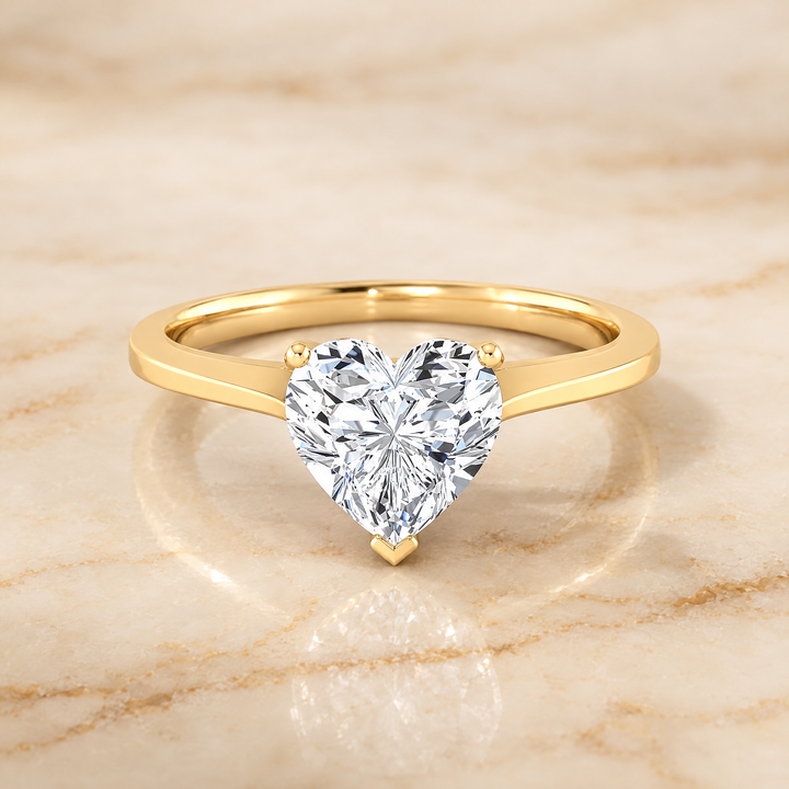The Elena Timeless Graduated Beveled Shank Solitaire Heart Engagement Ring Setting in 18K Yellow Gold